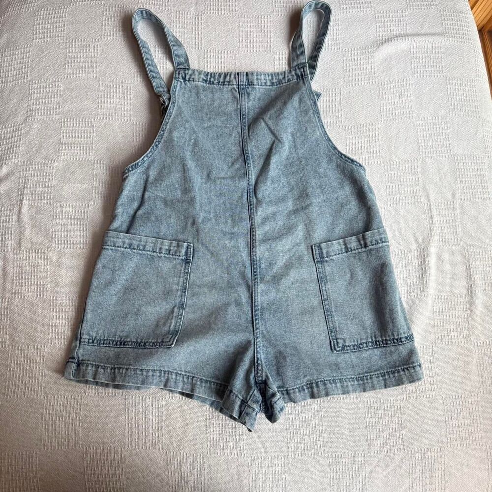 Aerie Size medium light jean shorts romper with adjustable straps.